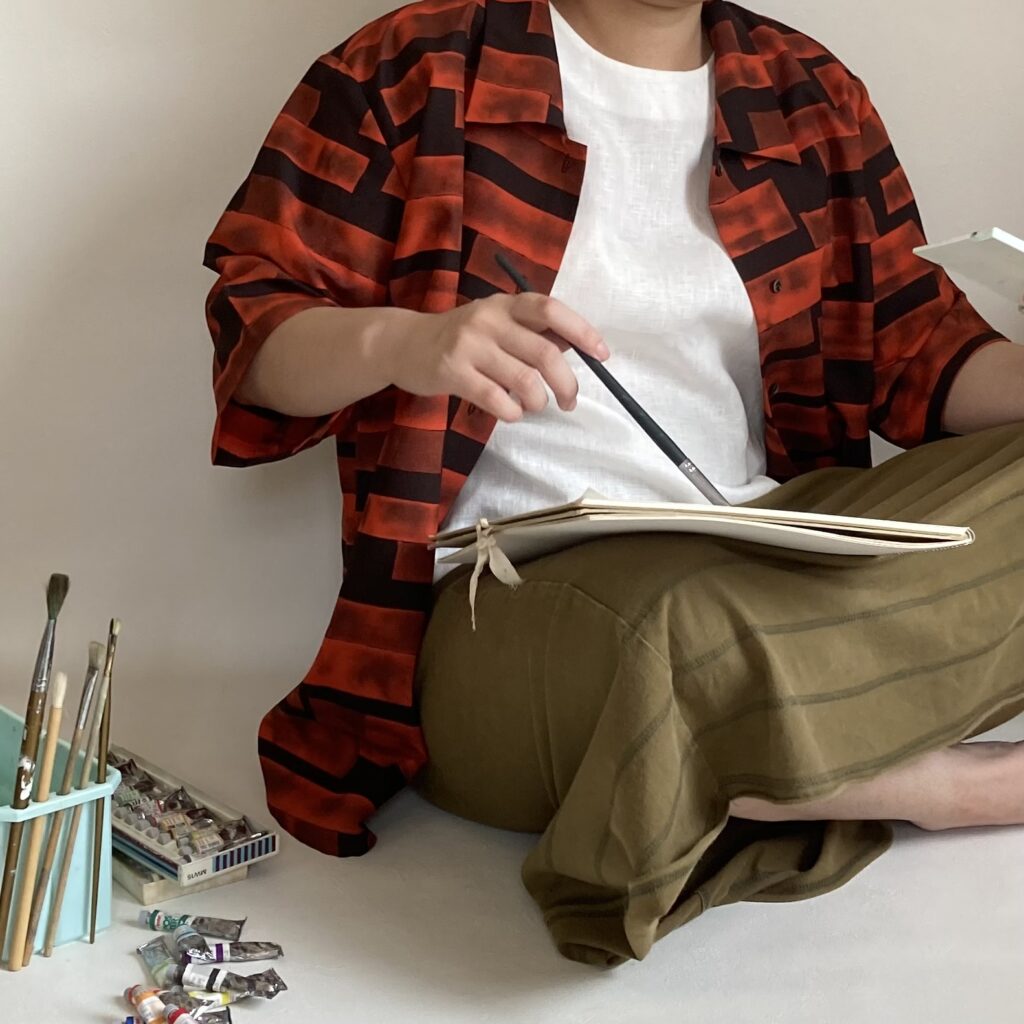 絵をかいてる人　アート服　オレンジ　派手　個性的なシャツ　アップサイクル